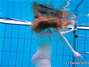 mind-blowing girl demonstrates splendid body underwater